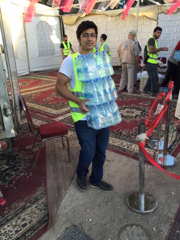 Moaz distributing food to refugee families during Ramadan in Jordan
